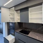 modern dark kitchen remodel Tustin with LED lighting