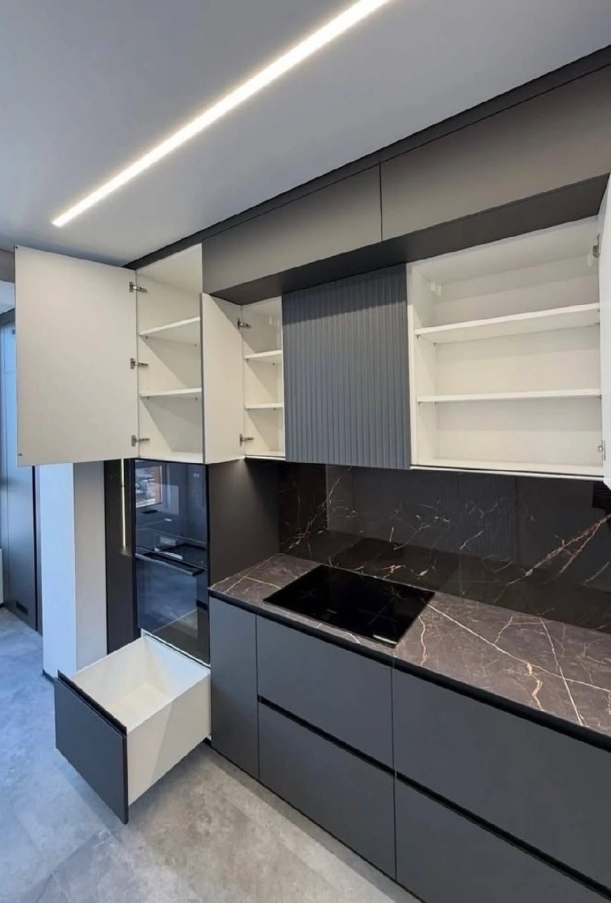 modern dark kitchen remodel Tustin with LED lighting