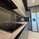 sleek dark European kitchen remodel in Tustin